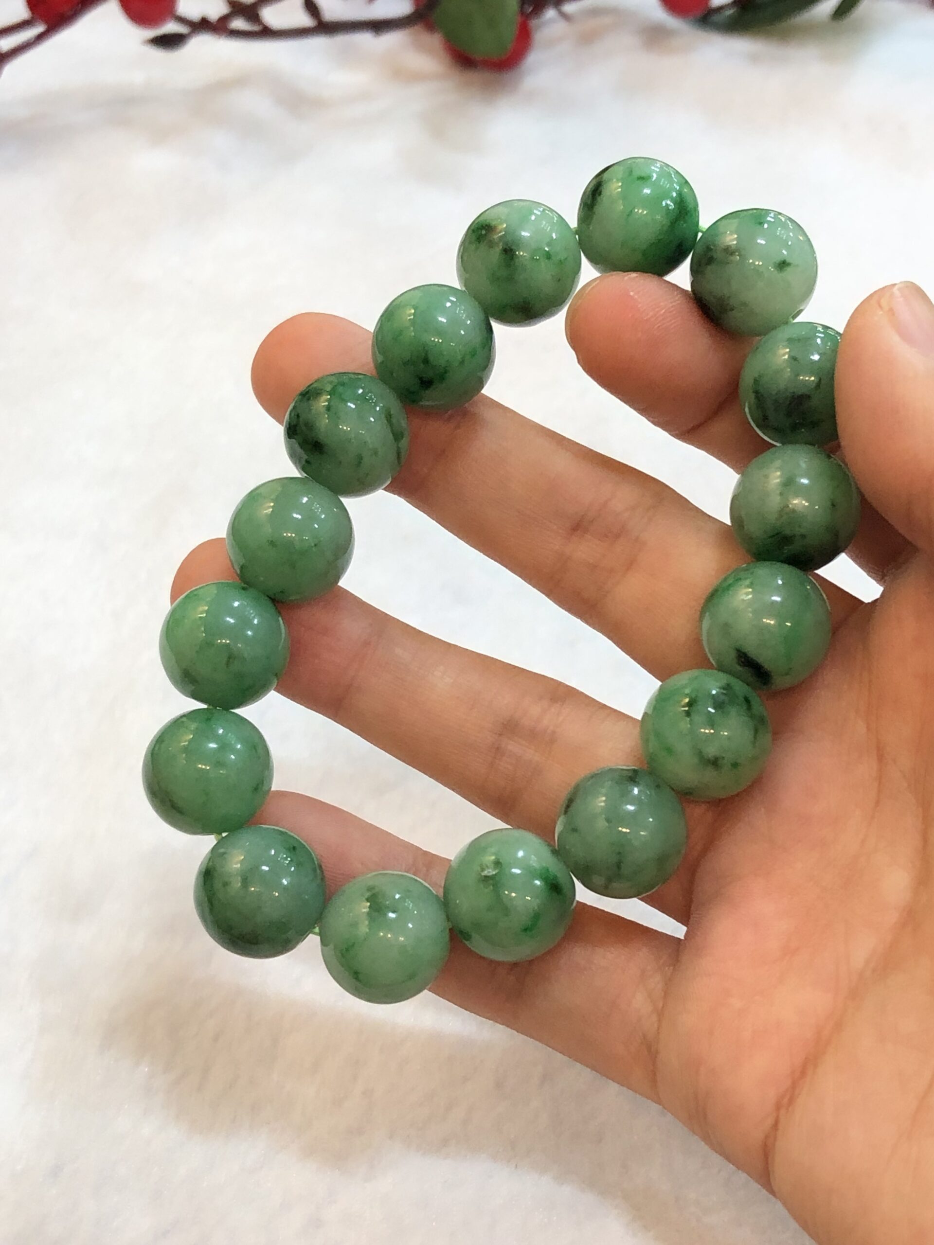 At Auction: CHINESE HETIAN GREEN JADE BEADED BRACELET